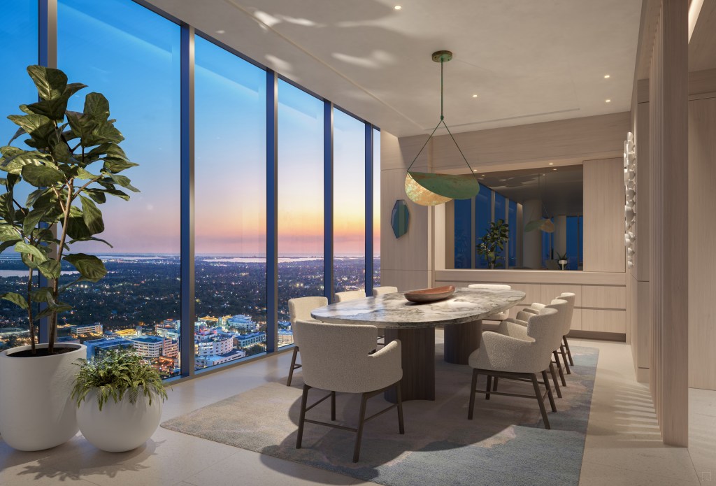 Dining room with windows overlooking a view of the city, dining room with potted plants and an area rug, dining room pendant light