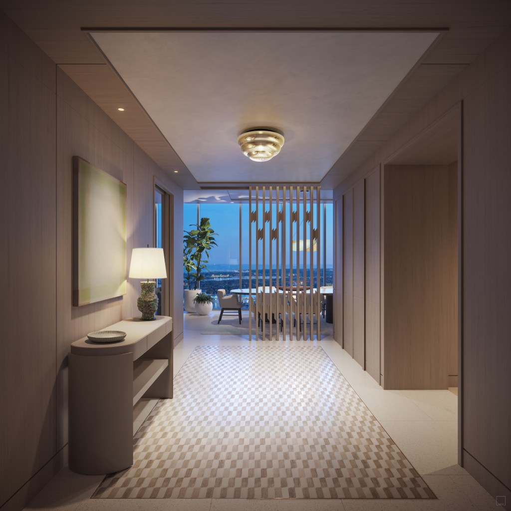 Foyer with a lamp and decorative bowl on a console table and hanging art on the wall and the entry floor has a wavy checkered pattern