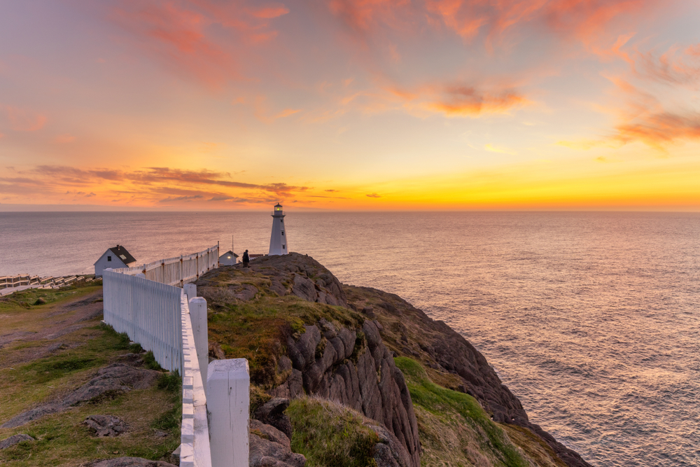 A lighthouse with a sunset at Cape Spear National Historical Site