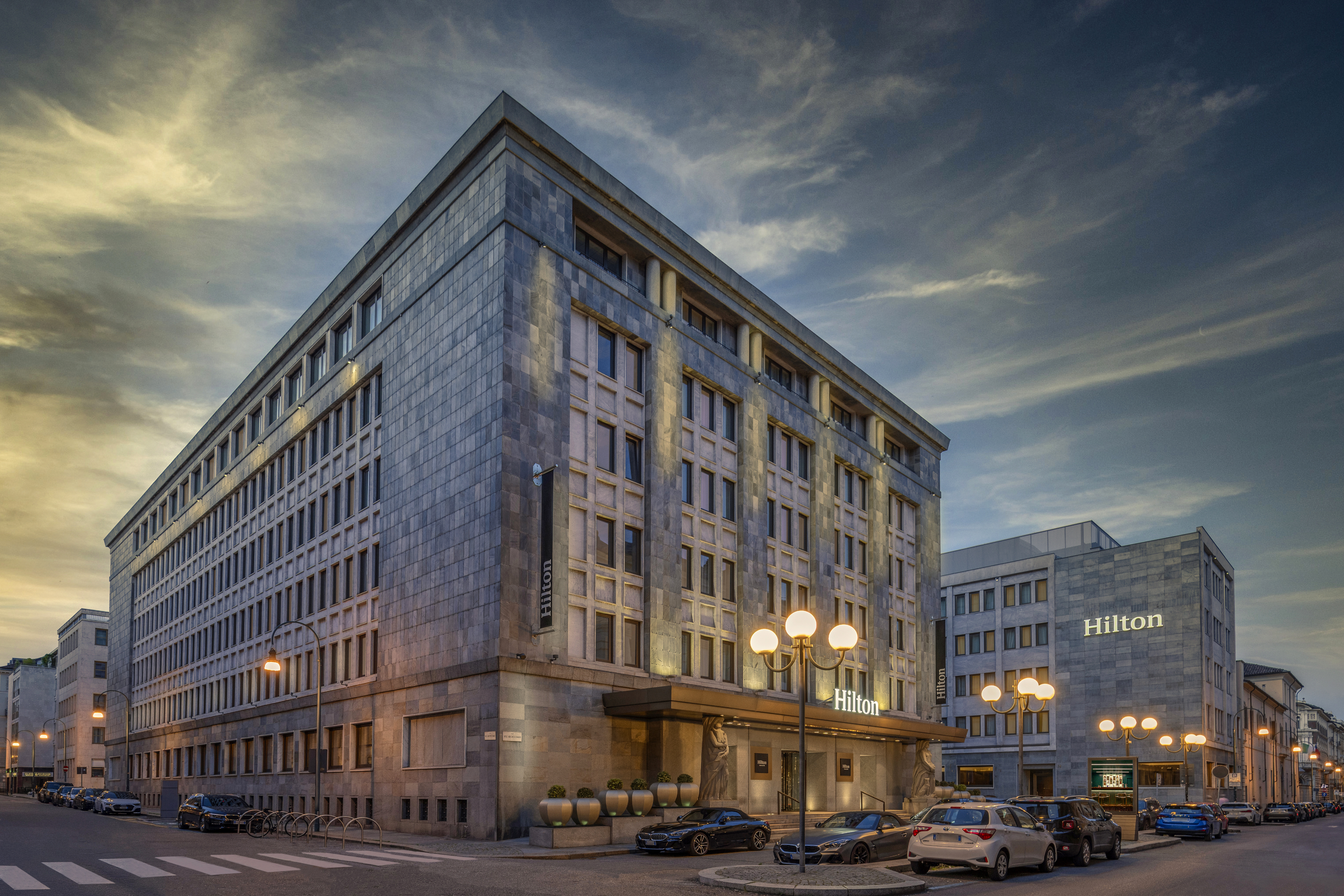Hilton Turin Centre exterior at dusk