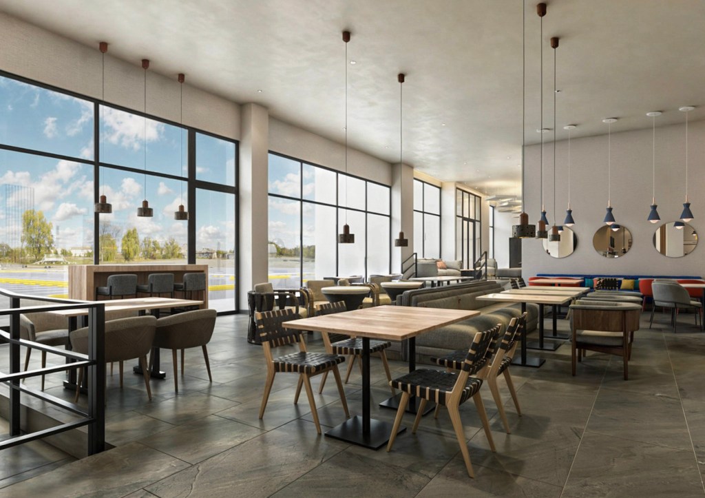 Spacious dining area with large windows and modern seating.