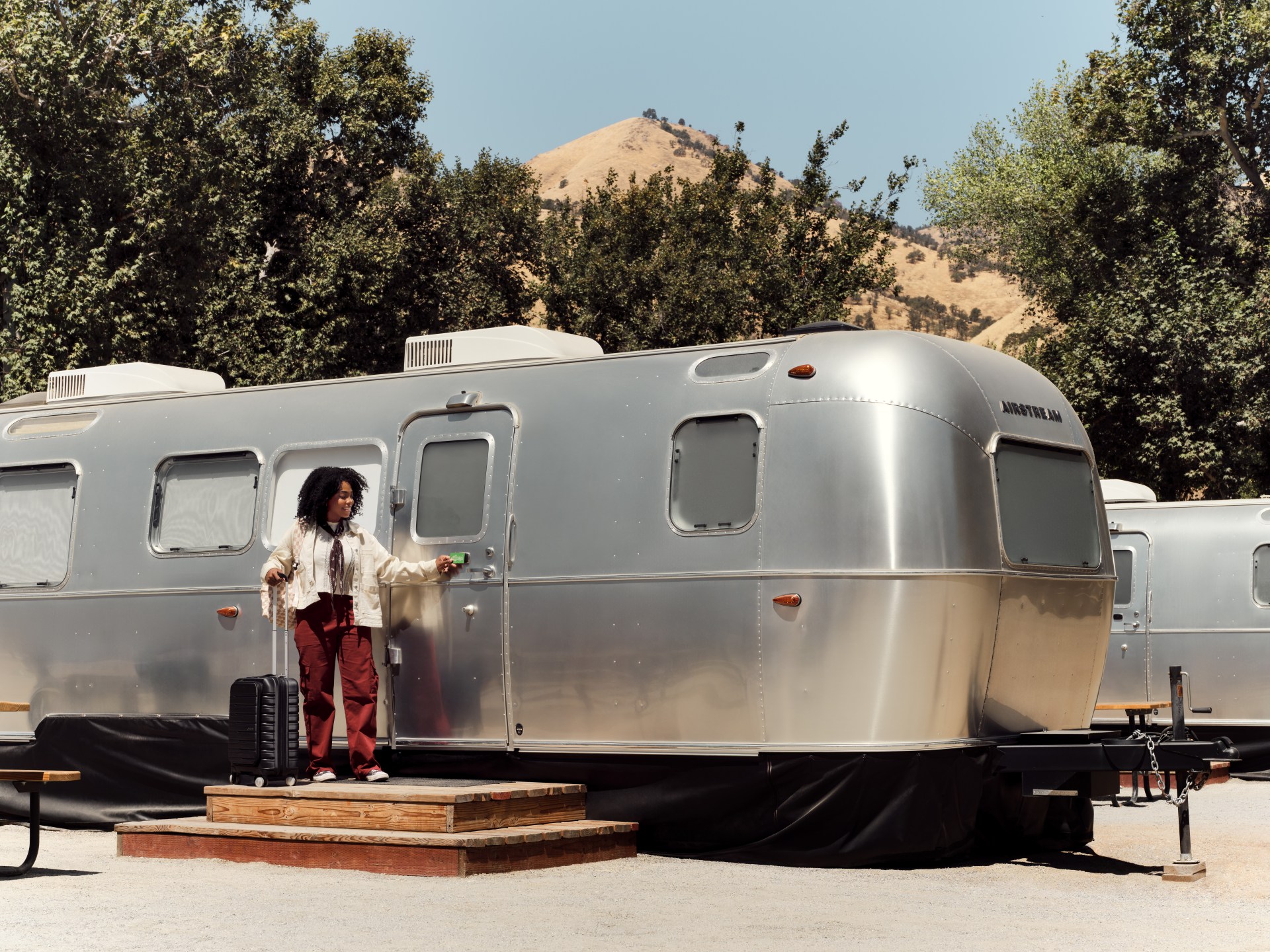 AutoCamp Sequoia, woman stading outside an autocamp trailer