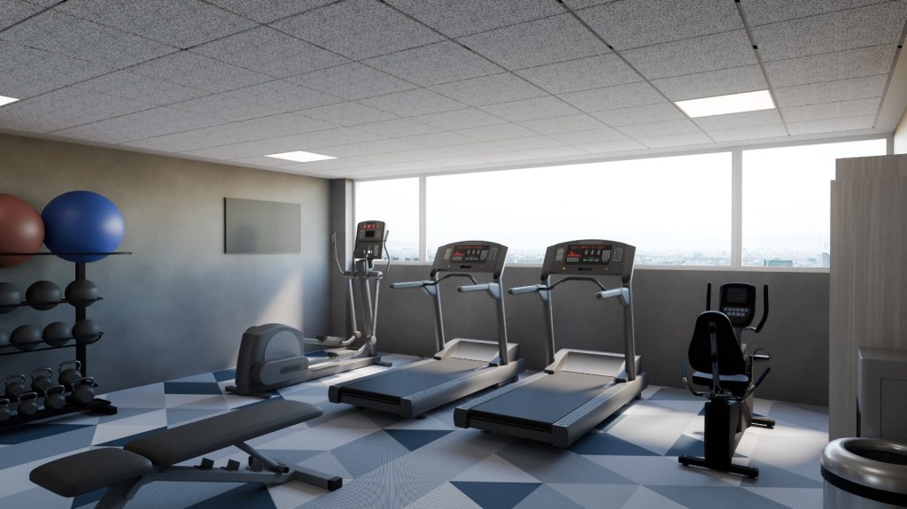 A gym with various equipment including treadmills, stationary bike, elliptical, and free weights