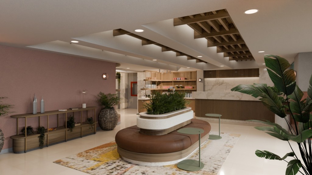 The lobby of the Hilton Garden Inn Mexico City Polanco, with central oval bench and repositionable personal desks, and the front desk in the background