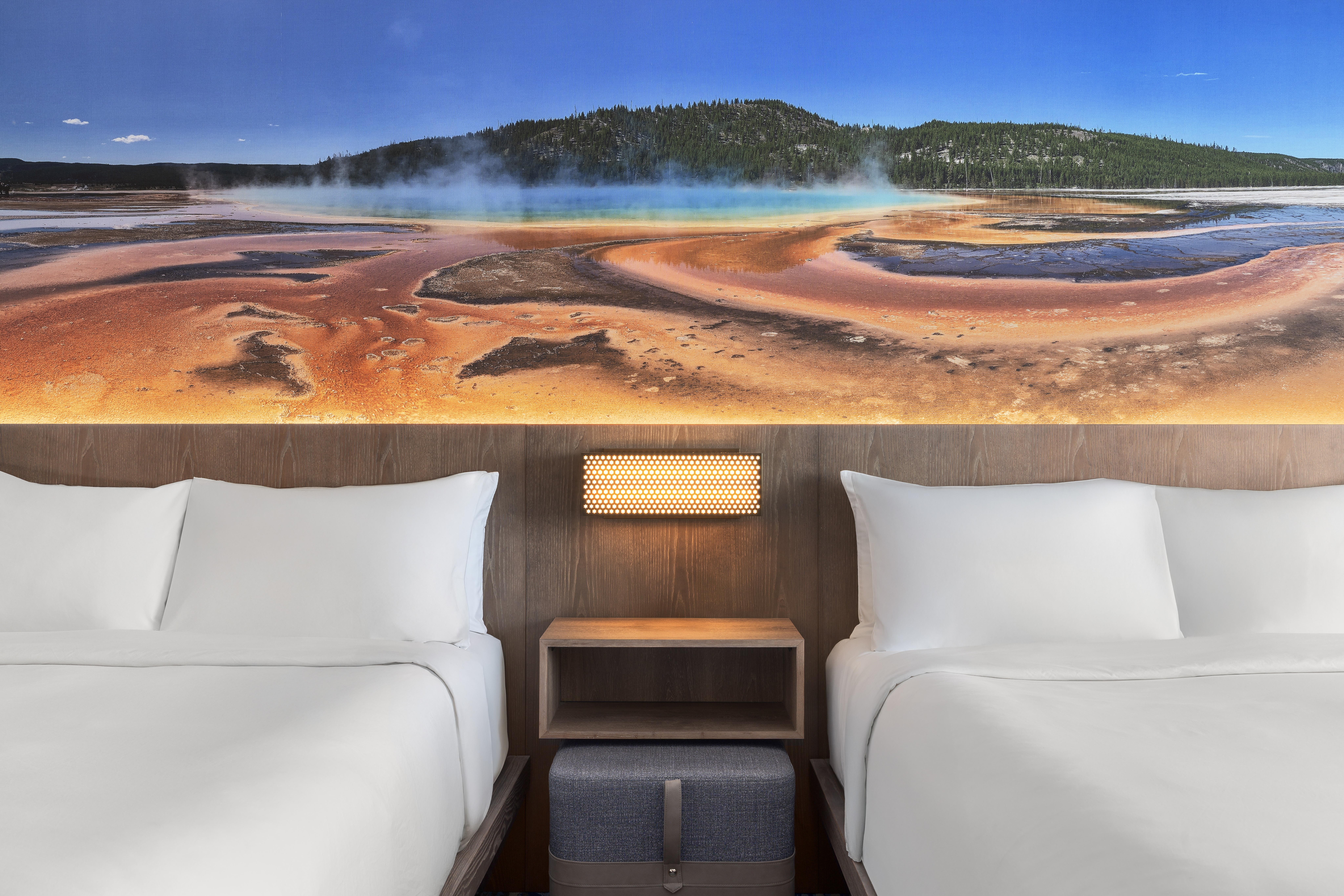 2 queen room close up details of beds and Yellowstone mural at Starlite Yellowstone, Tapestry Collection by Hilton