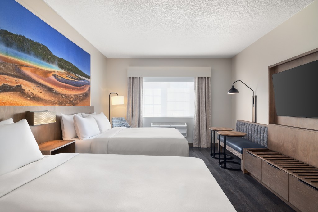 Guest room with 2 queen beds, Yellowstone mural, window, Starlite Yellowstone, Tapestry Collection by Hilton -