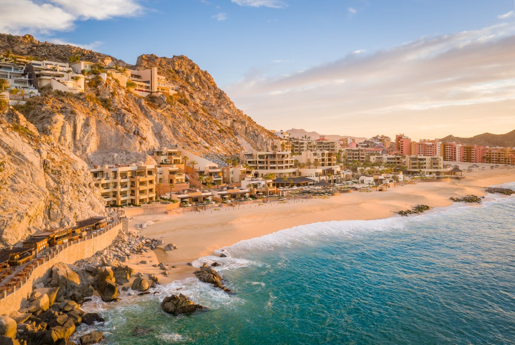 Waldorf Astoria Los Cabos Pedregal Aerial View, Beachfront, sandy beach with waves, rock cliffs