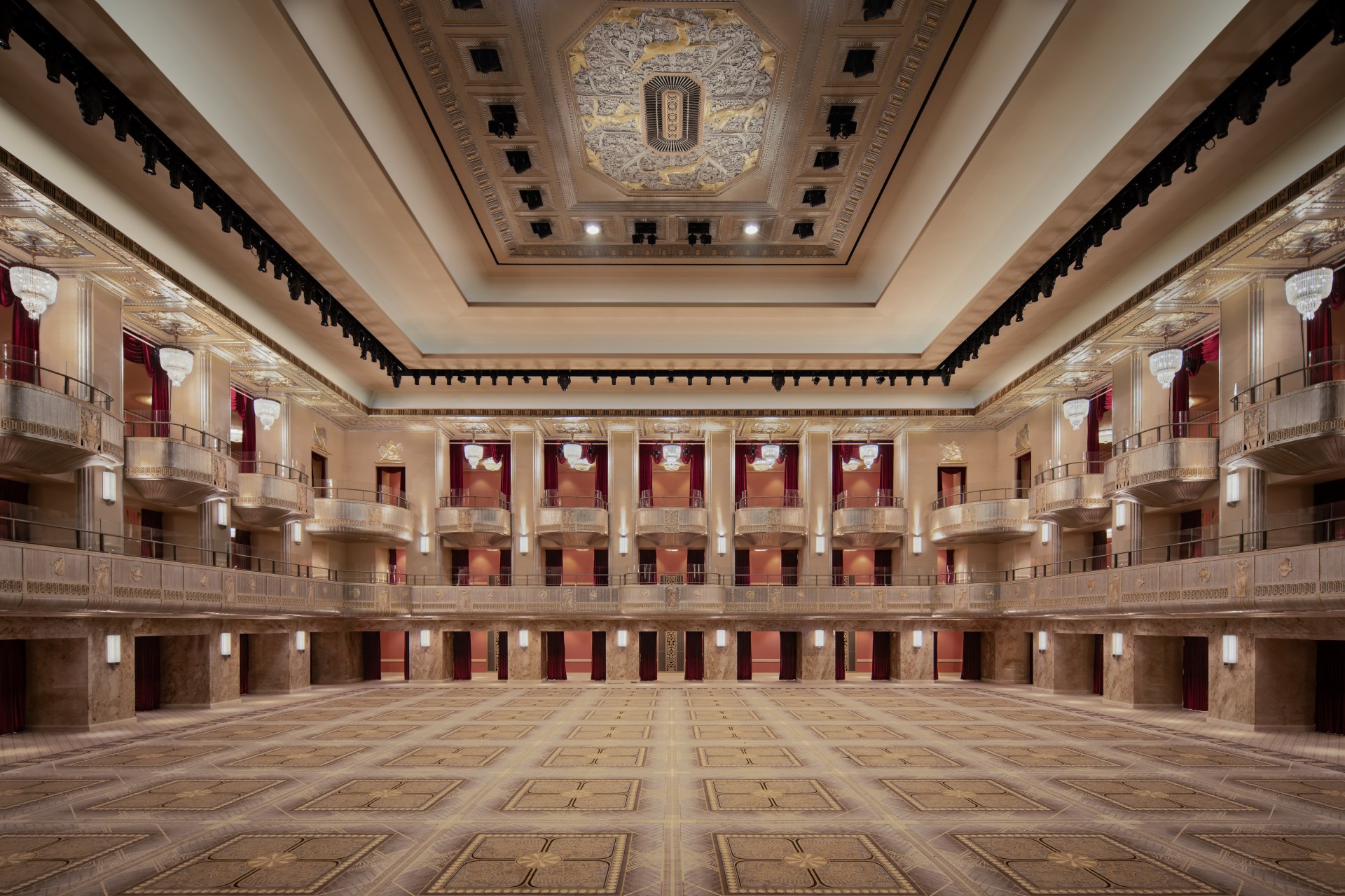 Waldorf Astoria New York - Grand Ballroom - Hilton, three-story event space with curtained balconies, Performance venue, luminescent cove lighting, decorative plaster bas relief medallion at the center of the ceiling sculpted by Eugene Rochette and Michael Parzini
