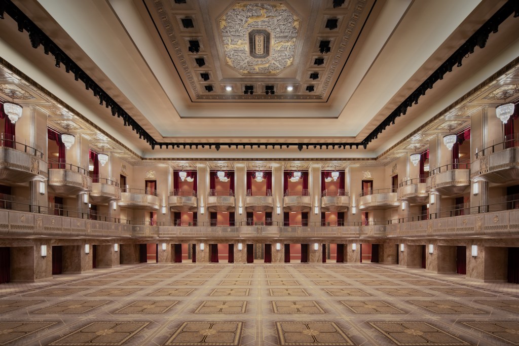 Waldorf Astoria New York - Grand Ballroom - Hilton, three-story event space with curtained balconies, Performance venue, luminescent cove lighting, decorative plaster bas relief medallion at the center of the ceiling sculpted by Eugene Rochette and Michael Parzini