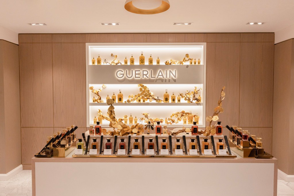 Guerlain retail area showcasing perfumes and decor.