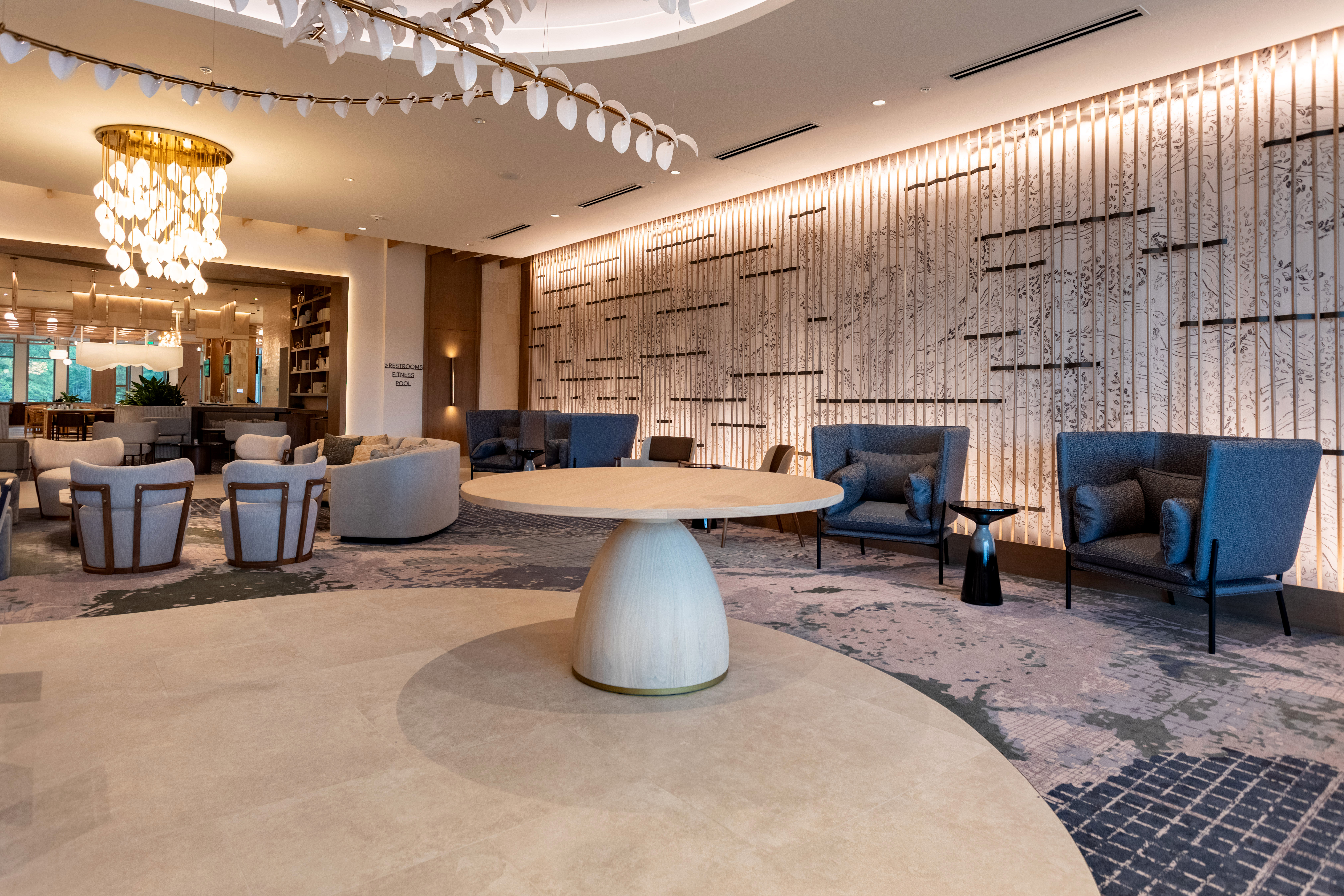 A lobby with various clusters of chairs