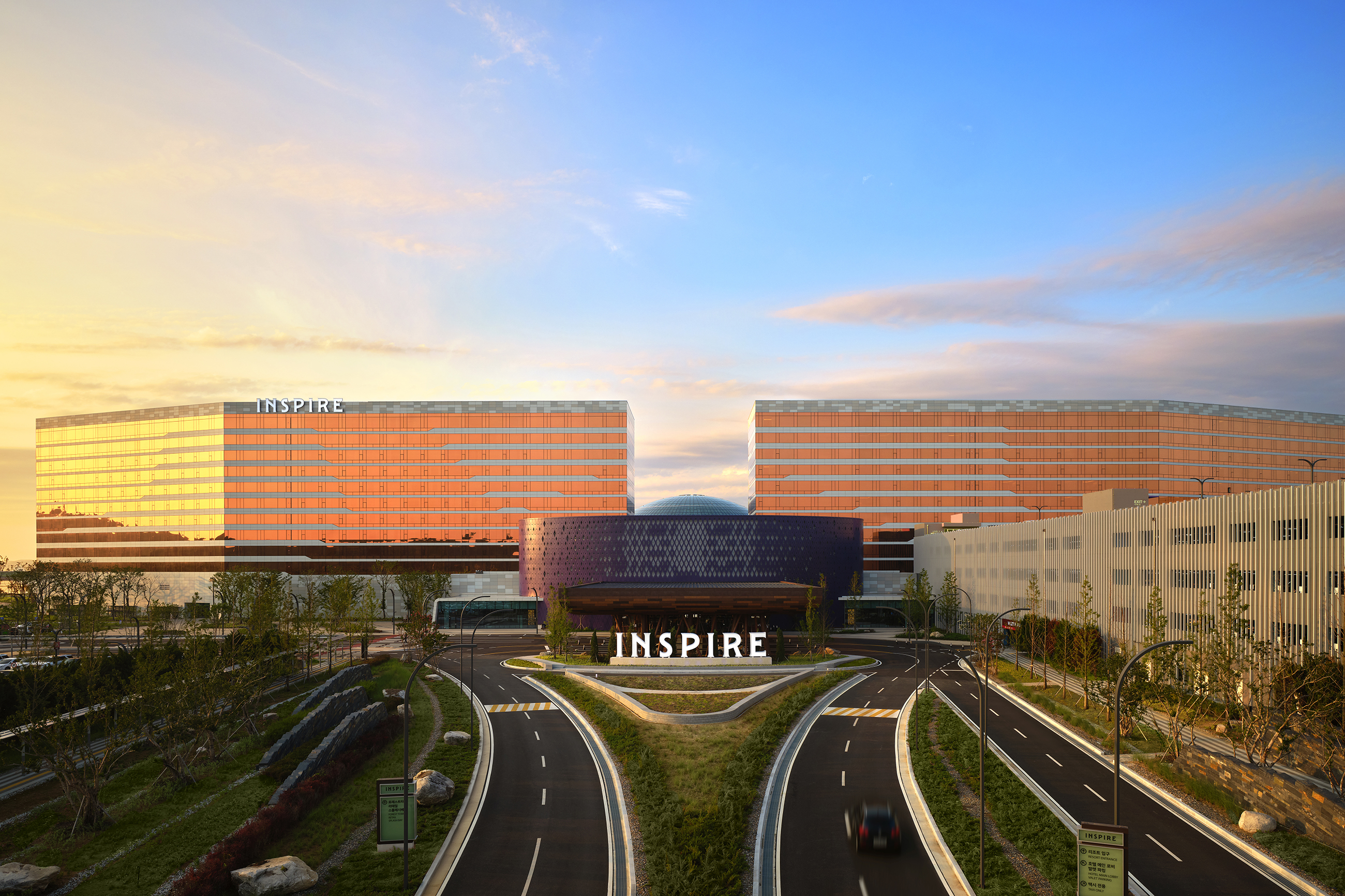 exterior of a hotel with road going around