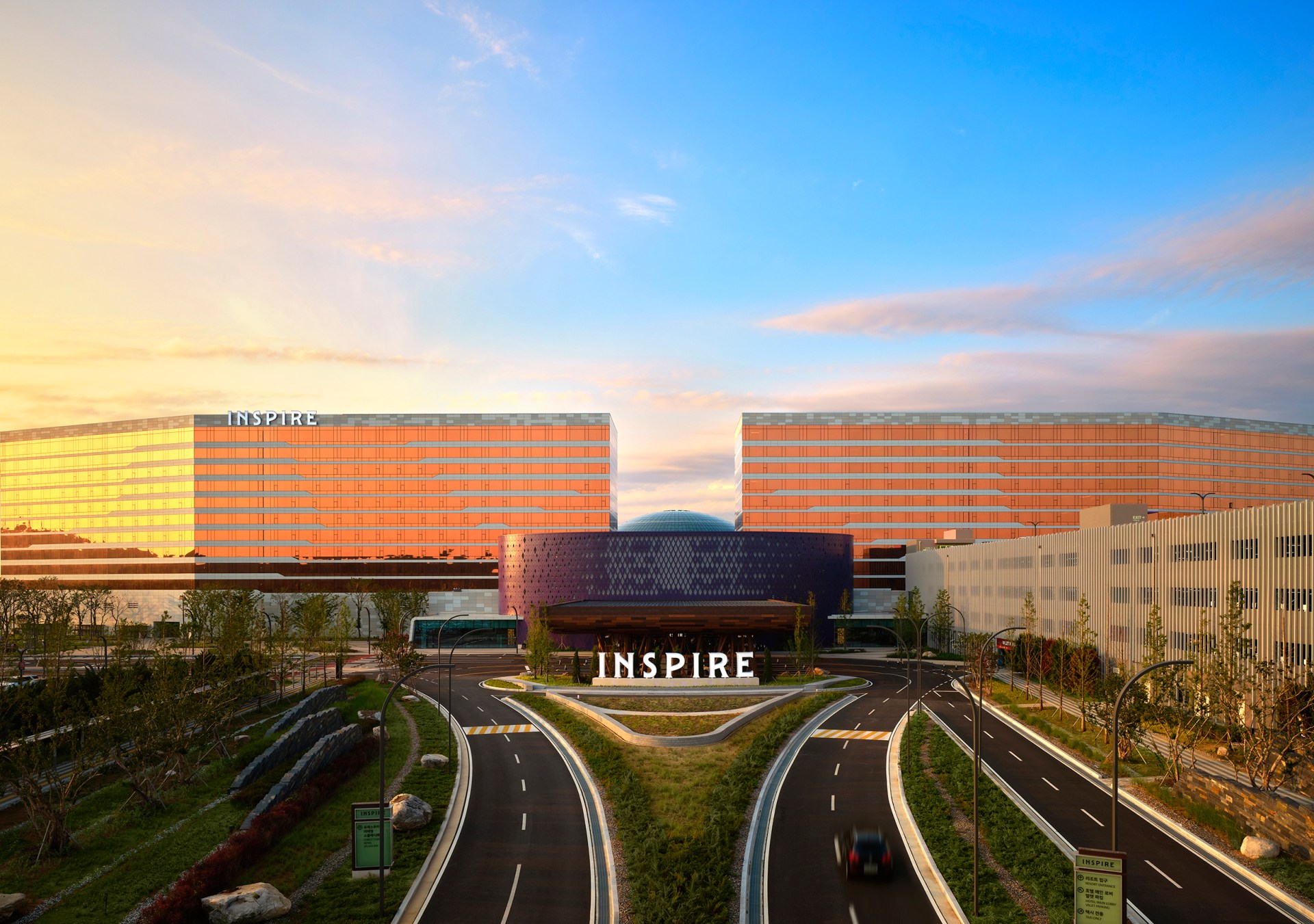 exterior of a hotel with road going around