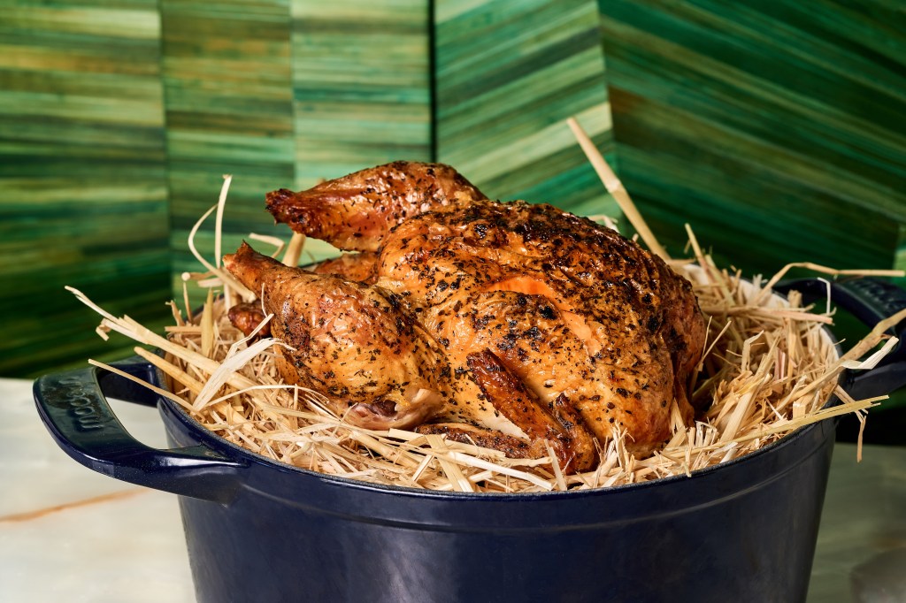 A roasted chicken served in a dutch oven