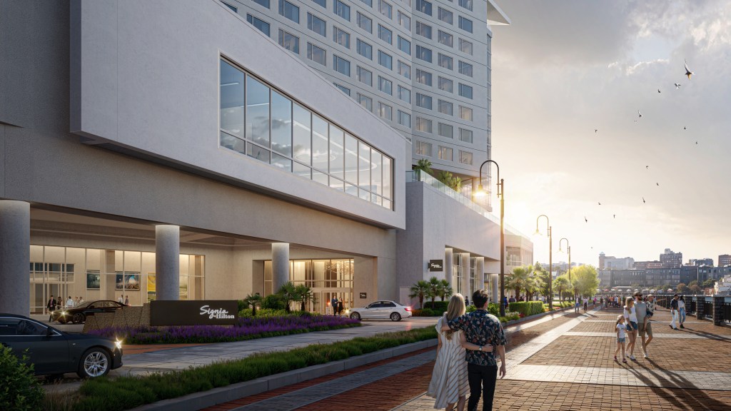 An eye level view of the hotel from the riverfront walk way