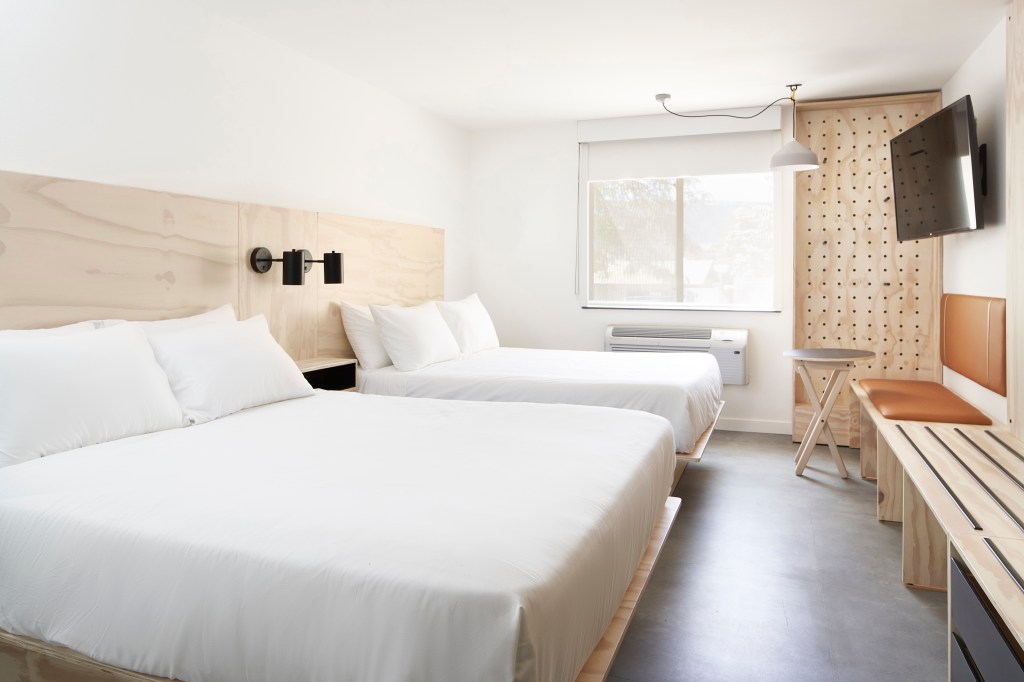 Slackline Moab, Outset Collection by Hilton - Double Queen Room - two queen beds with white bedding, light wood accents, television, seating area