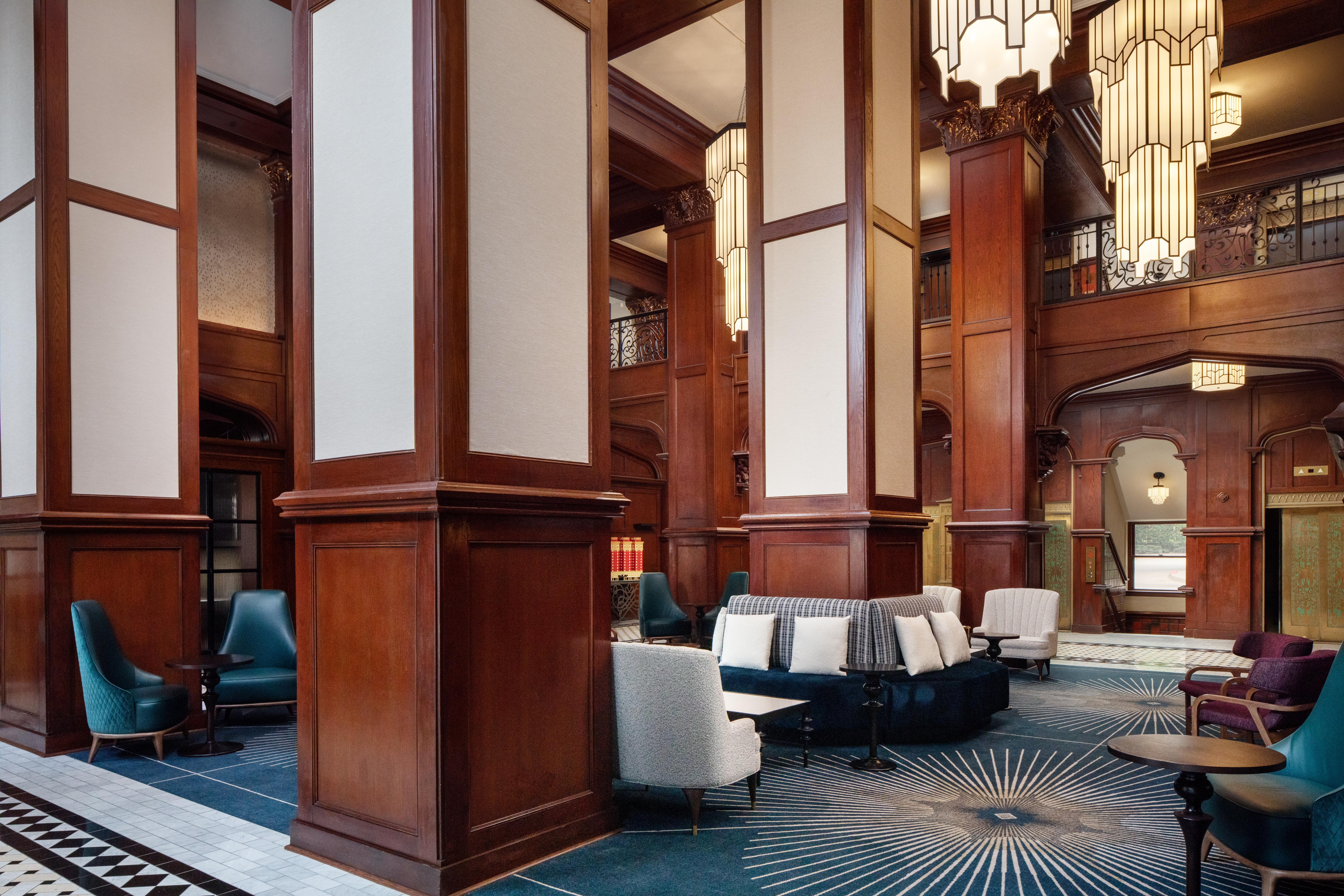 various seating areas between the columns of the lobby