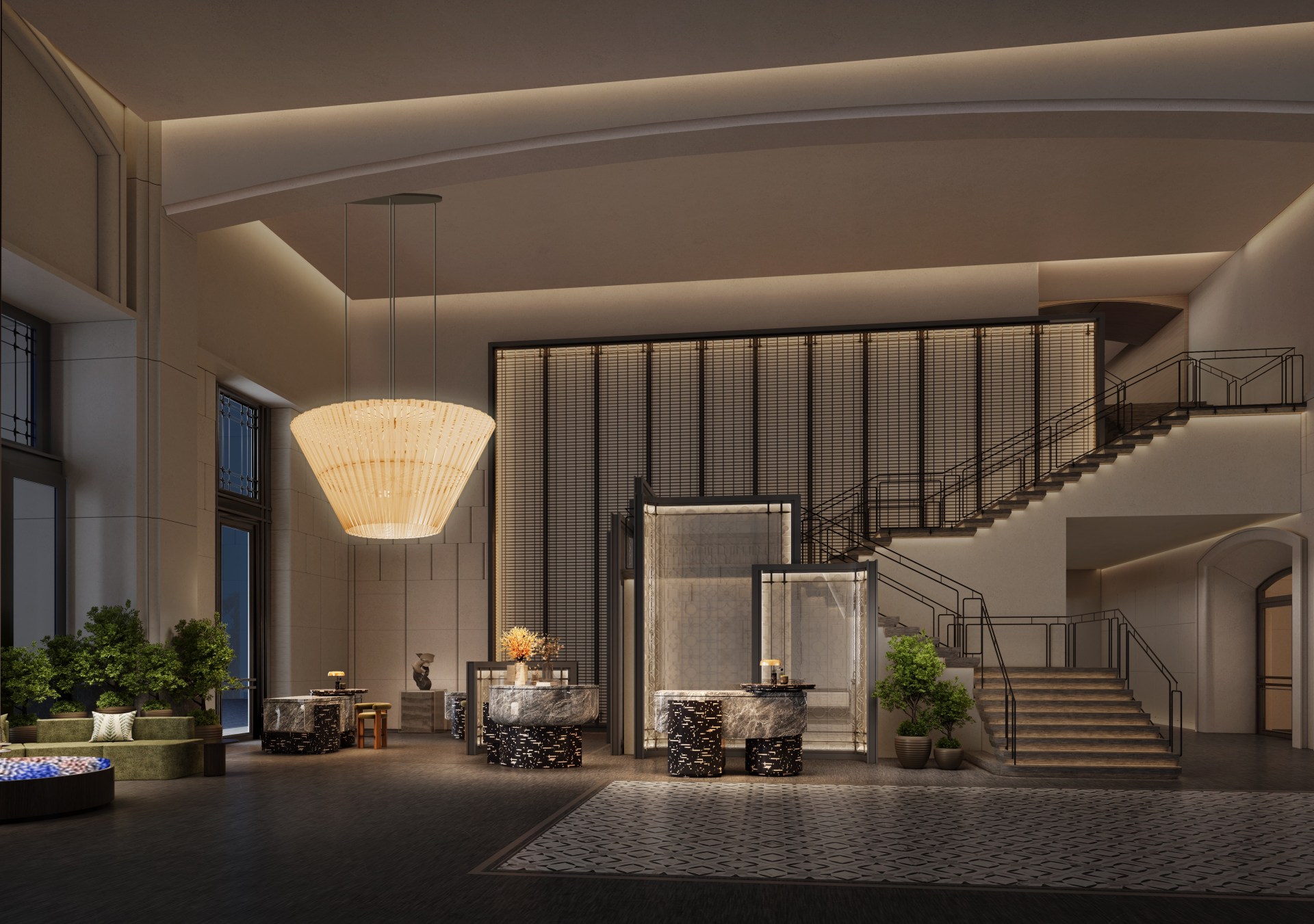 The lobby area with front desks, sitting area, and large staircase