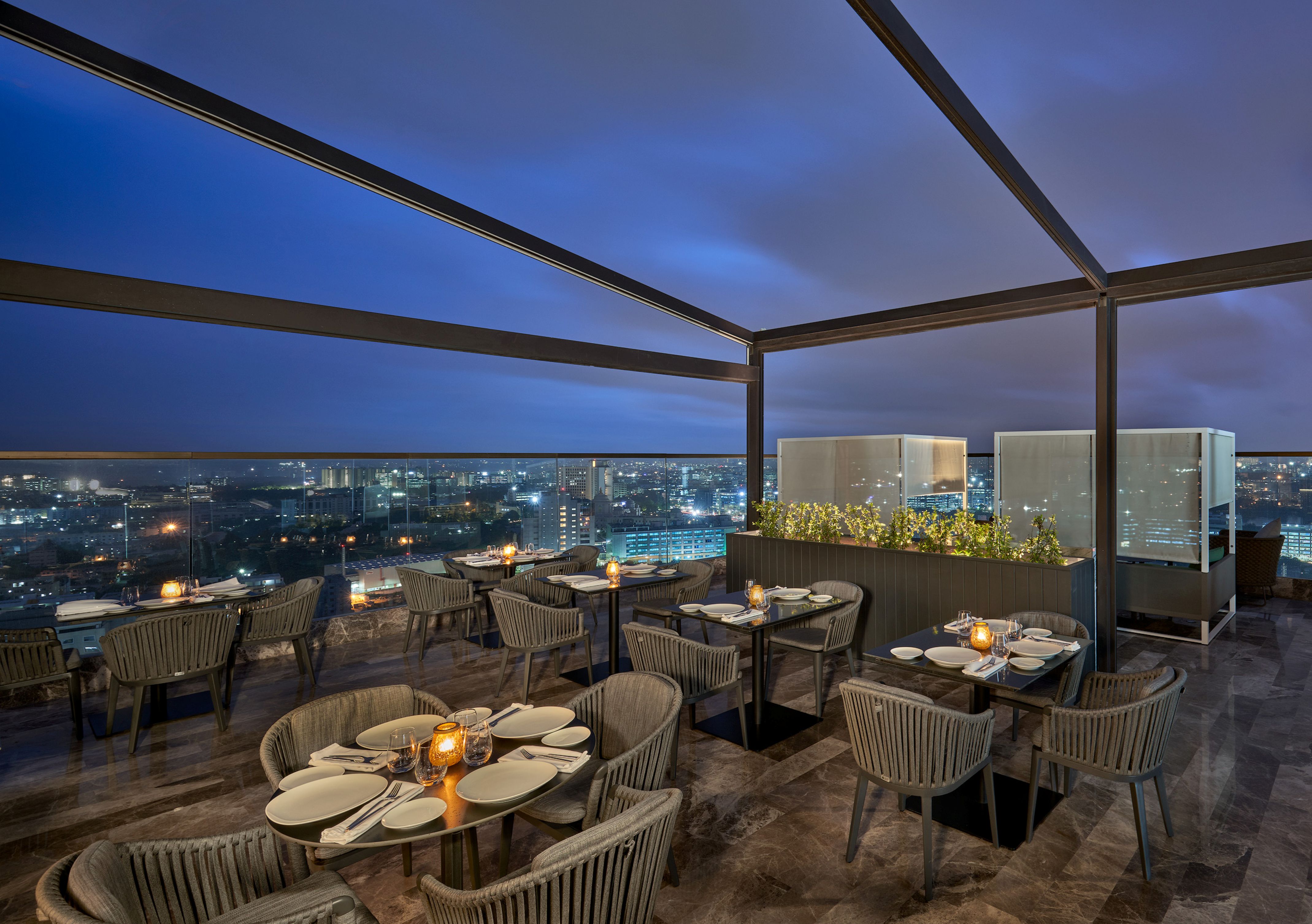 The Den Bengaluru, LXR Hotels & Resorts - Outdoor Dining area at night