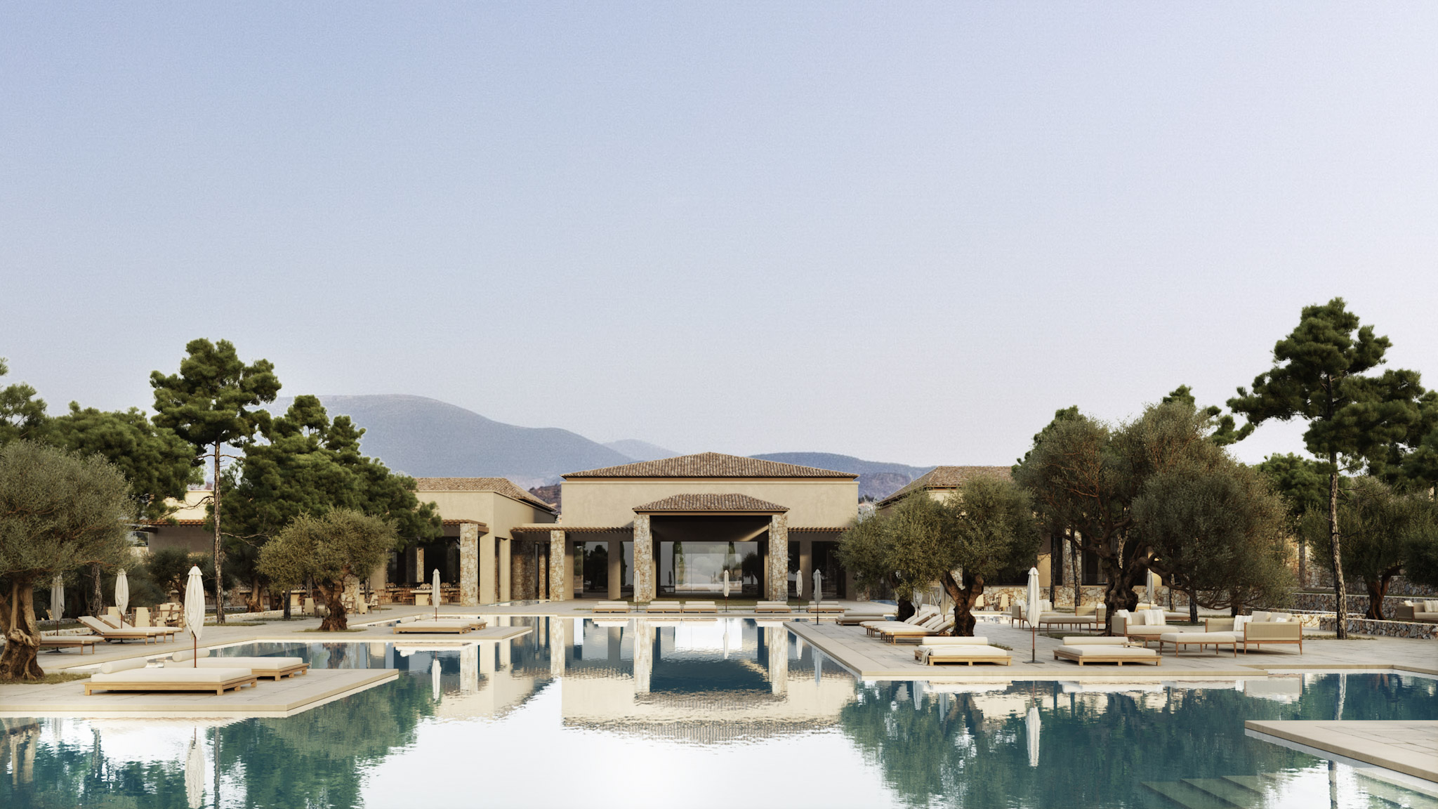 The main pool at Waldorf Astoria Scarlet Bay reflecting the resort’s grand entrance framed by olive trees.