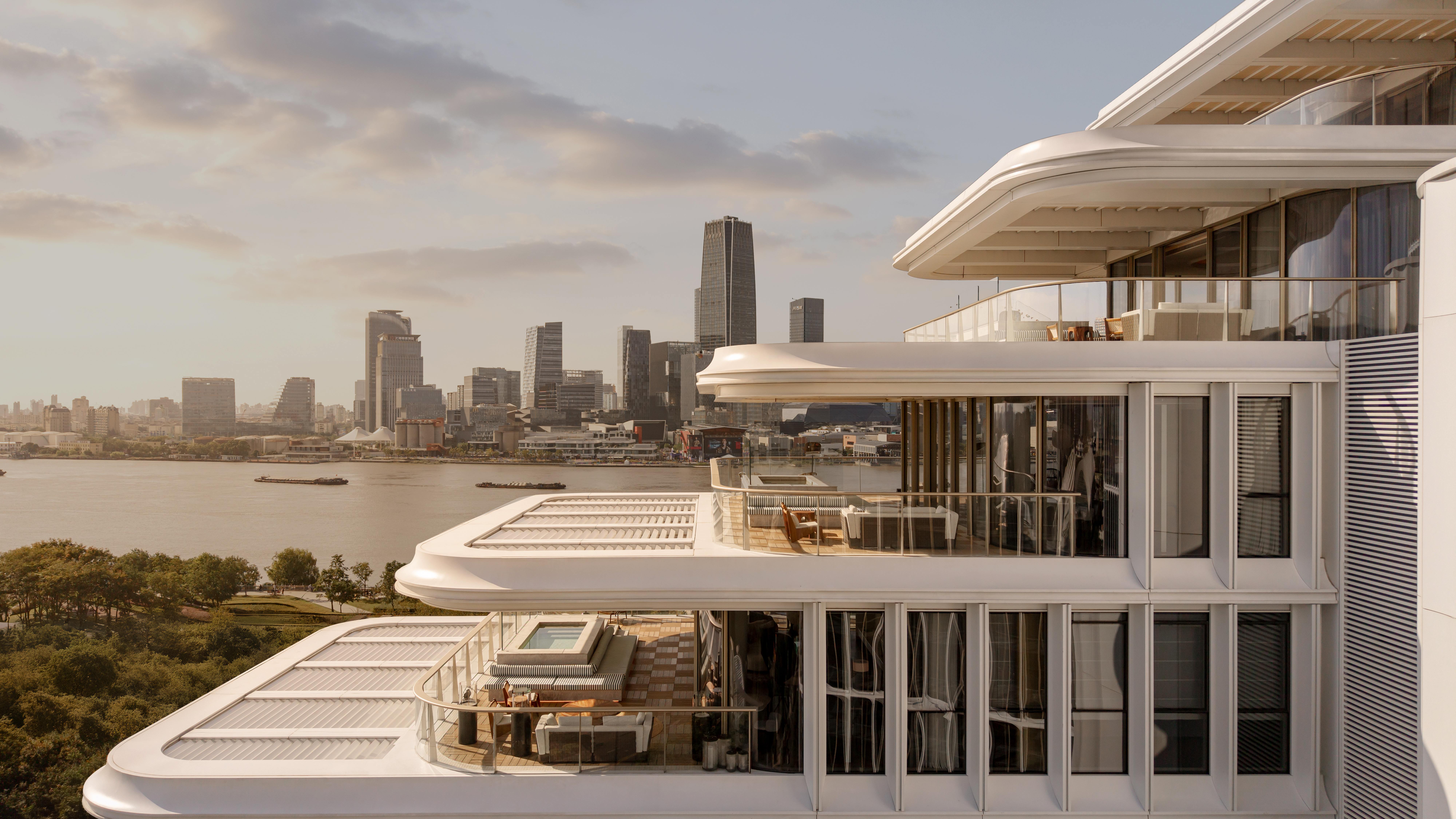 The exterior of the hotel with tiered roofs, looking out over the river and city