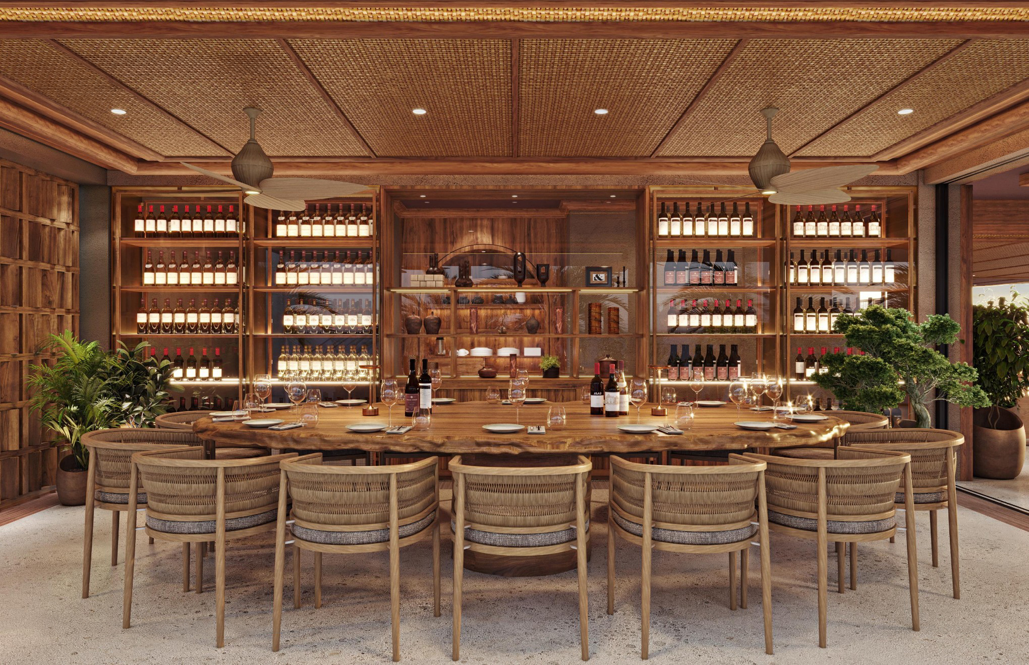 A private dining room, with one large table, with a selection of wines stocked on shelves behind.