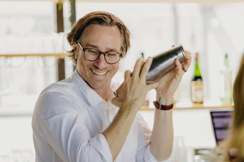 Derek Brown shaking a cocktail