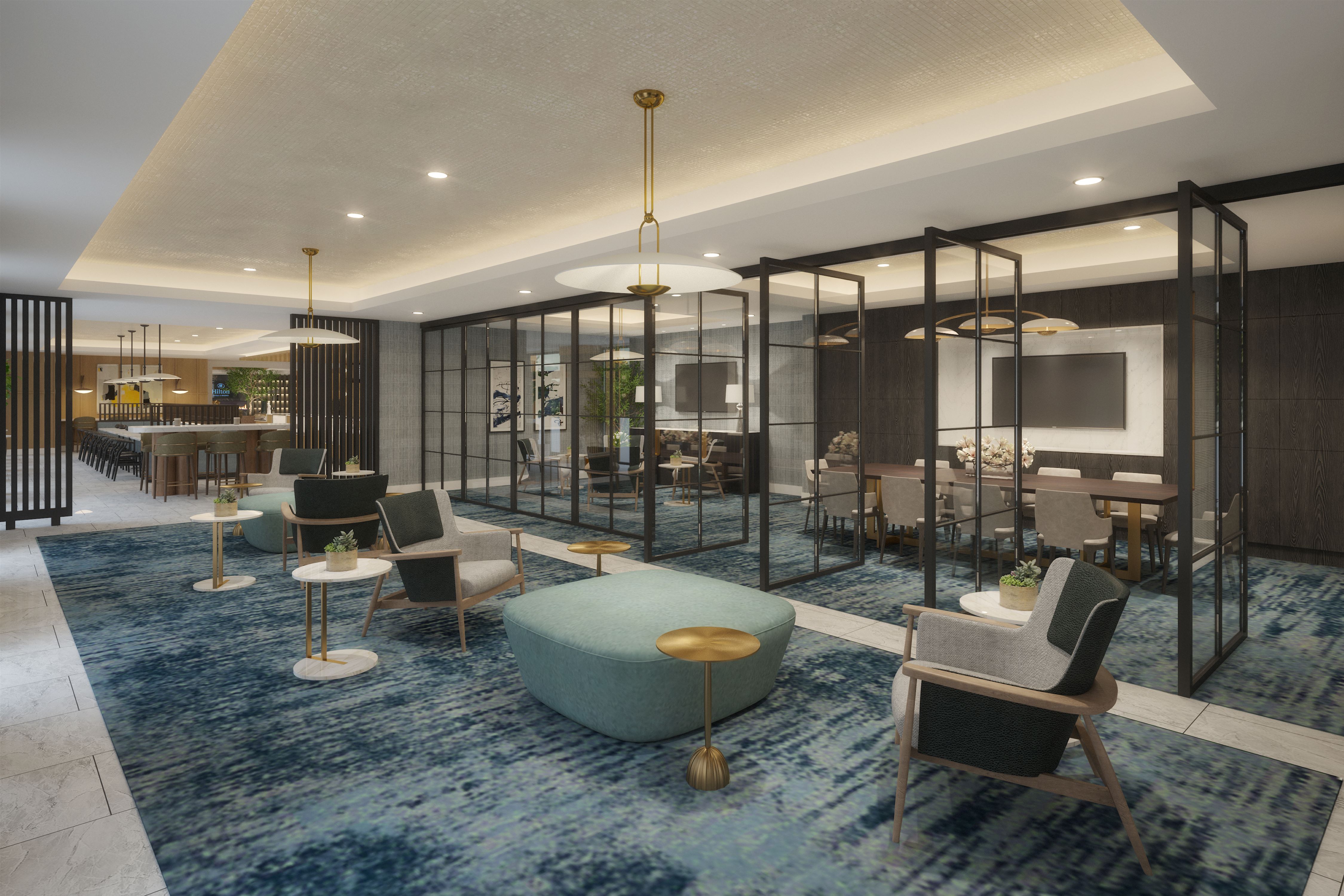 A meeting room with several seating areas that can be separated into smaller rooms.