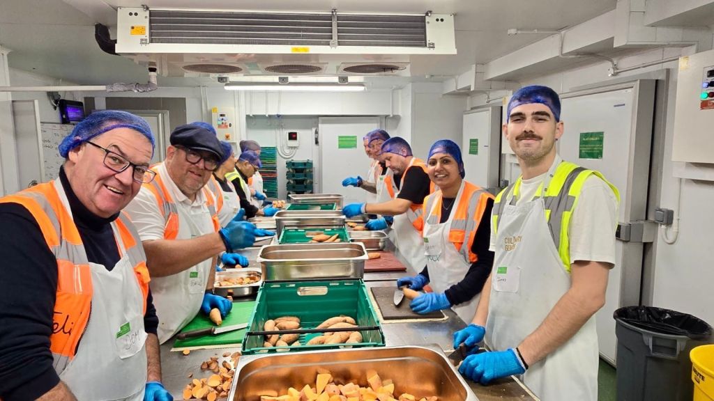 Hilton Travel with Purpose Week 2025 - Hilton London Hyde Park - team members peeling sweet potatoes in a kitchen