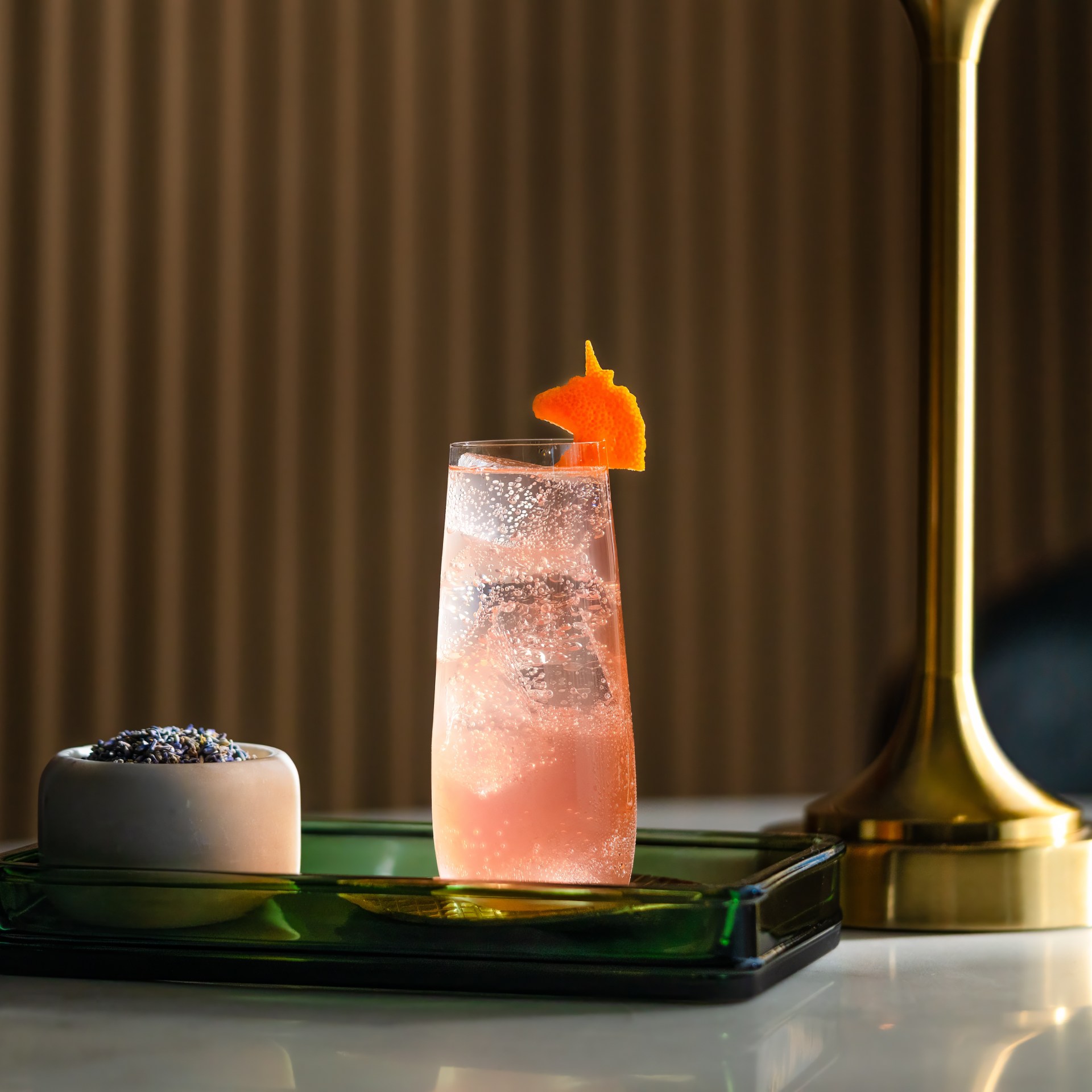 Tempo by Hilton - Pink Grapefruit Club - sparkling pink drink on a tray
