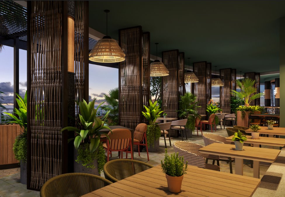 The Diplomat Beach Resort Playa Interior dining area with potted green plants with rattan pendant lighting