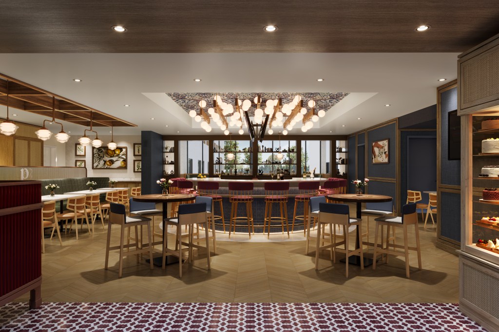 Modern bar and dining area with curved bar, red stools, chandelier lighting, wood tables, dessert display, and warm, inviting design.