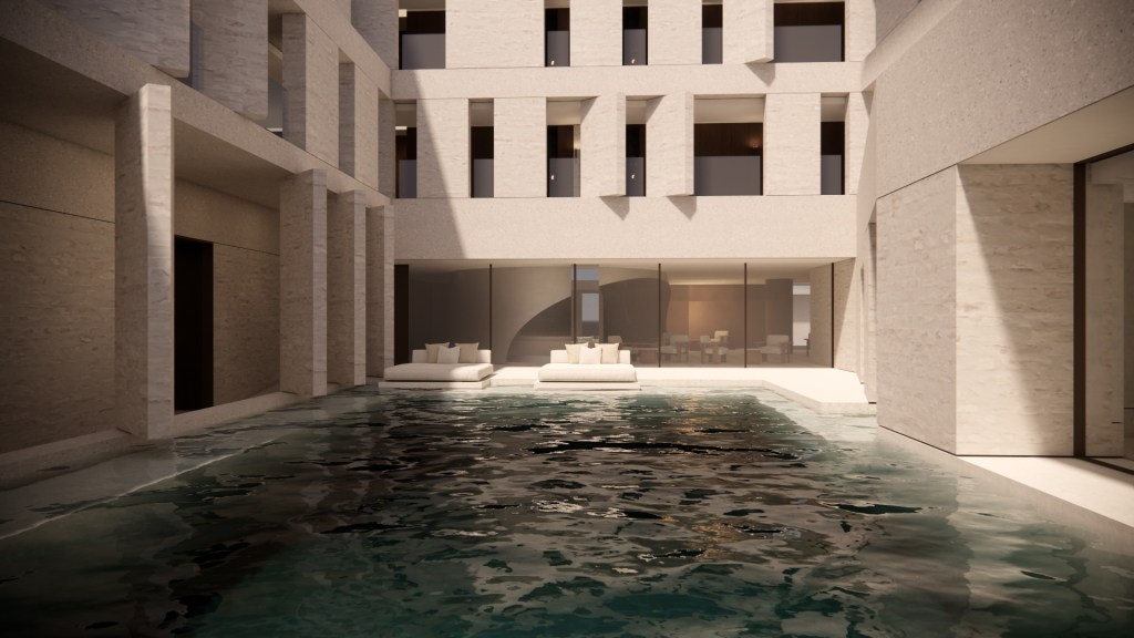 Modern stone building of the The Mountain The Sea Dali, Curio Collection by Hilton with a pool in the foreground and two cushioned lounge seats near glass doors.