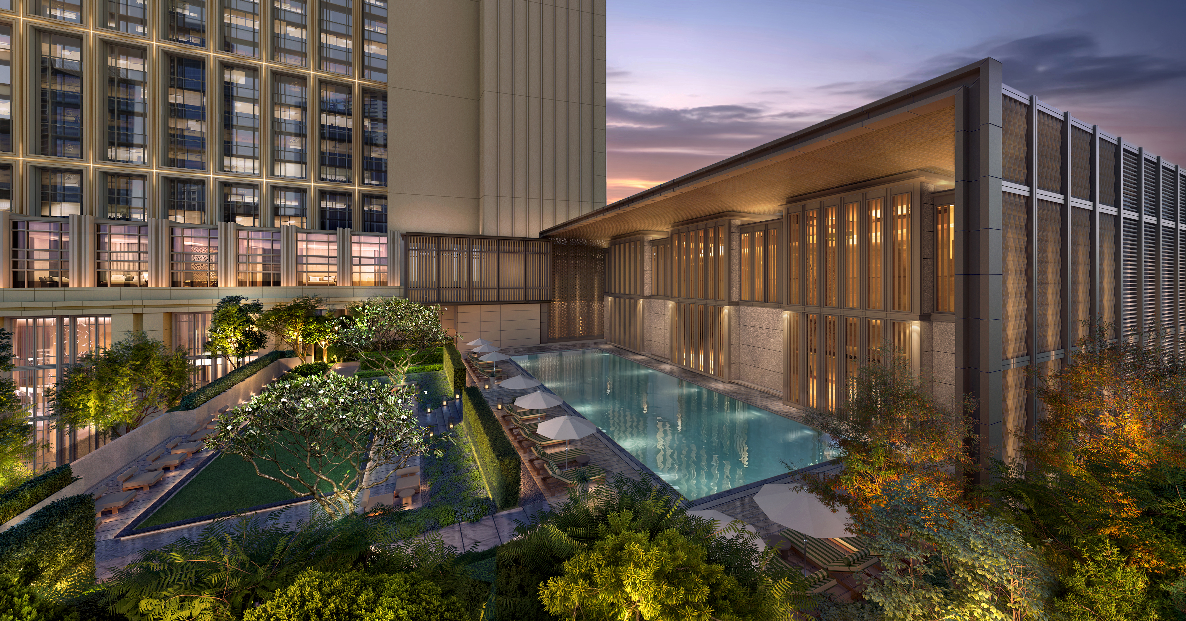 Modern rooftop pool area at the Waldorf Astoria Kuala Lumpur at dusk with lounge chairs, umbrellas, greenery, and a tall building in the background.