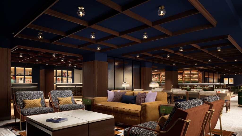 Luxurious lounge area with mustard sofa, patterned armchairs, wooden ceiling beams, and a well-lit bar in the background.